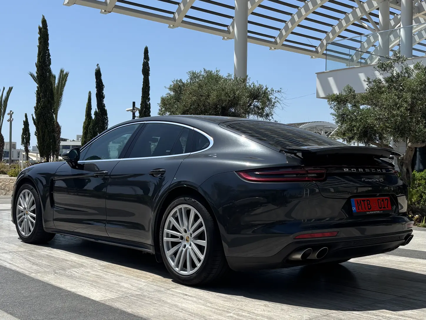 Porsche Panamera 4 - rear three-quarter view with the rear spoiler deployed